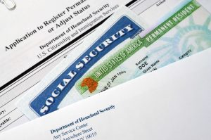 Images of immigration benefits cards including work authorization and social security